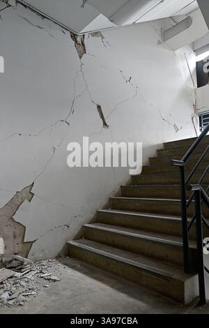 Cracked walls and exposed concrete at an upmarket Bangkok condominium in Thailand following the 28 March Myanmar earthquake Stock Photo