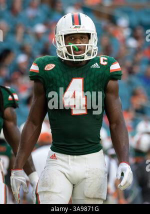 Running Mario Icon MIAMI GARDENS - OCTOBER 24: Miami defensive back Camdin Portis (21 ...
