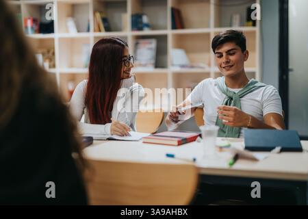 Engaged students collaborating during an interactive classroom study session Stock Photo