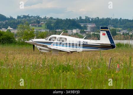 Wangen-Lachen, Switzerland, May 26, 2024 HB-DIA Mooney M20J propeller plane on a small airfield Stock Photo