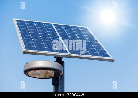 Solar power street lamp, Solar street light post led system in modern city road for energy saving infrastructure concept. Stock Photo