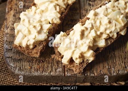 Two slices of bun with bread spread made of leftover Easter eggs Stock Photo