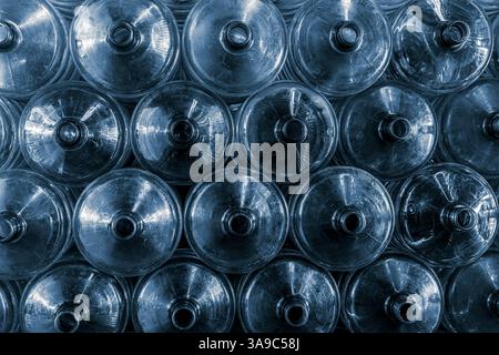 20 liters water gallon PET bottles stacked pile in drink water factory stock warehouse storage area Stock Photo