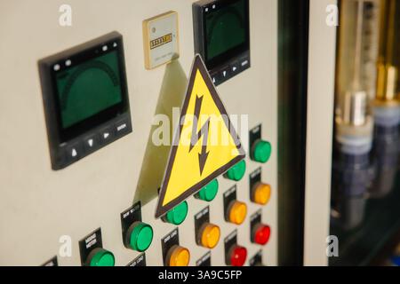 high voltage electric box, Electricity control panel with bottle machine operator in factory Stock Photo