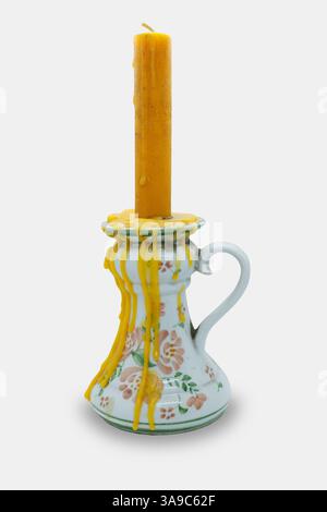 antique candle holder vintage style with handle and candle wax dripping flow down isolated on white background with clipping path Stock Photo