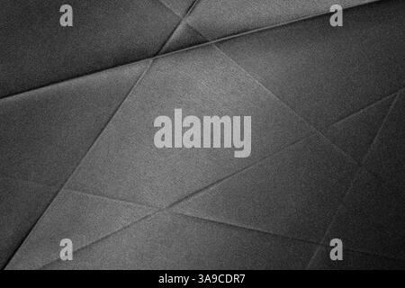 The surface showcases a textured black fabric with diagonal lines creating an elegant, sophisticated appearance. Stock Photo