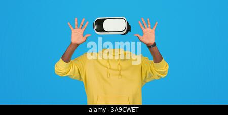 User interacts with VR technology using a headset and enhanced hands Stock Photo