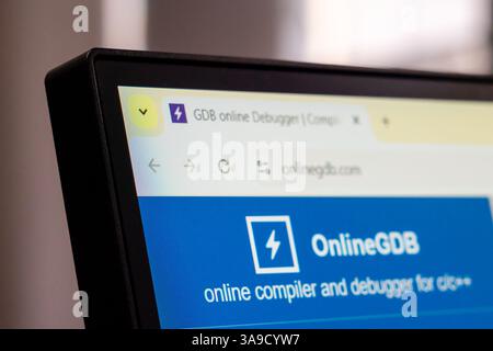 New York, USA - March 30, 2025: OnlineGDB online compiler and debugger website homepage displayed on computer monitor with logo and blue interface Stock Photo