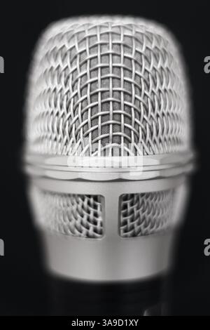 Microphone head with metal mesh close-up with shallow depth of field Stock Photo