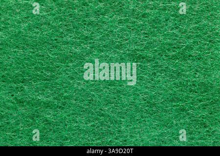 Abstract green background made of intertwined synthetic fibers. Macro photography Stock Photo