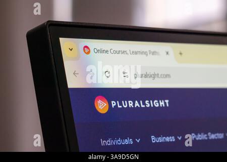 New York, USA - March 30, 2025: Pluralsight online technology learning platform homepage displayed on computer monitor with logo and site navigation Stock Photo