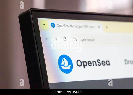 New York, USA - March 30, 2025: OpenSea NFT marketplace homepage displayed on computer monitor with logo and browser interface Stock Photo
