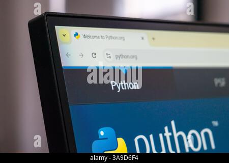 New York, USA - March 30, 2025: Python official programming language website homepage displayed on computer screen with logo and navigation bar Stock Photo