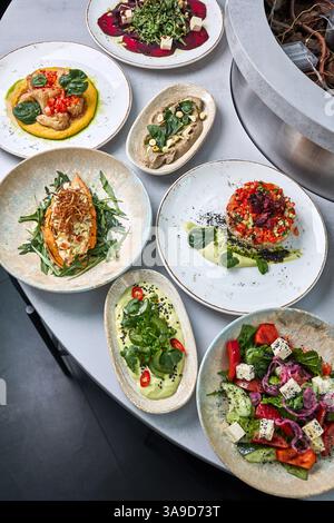 Assorted Gourmet Vegan Dishes on Elegant Table Stock Photo