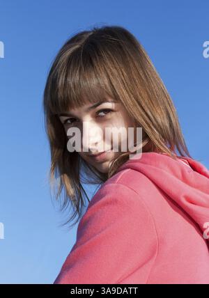 Portrait of a beautiful young woman against the sky Stock Photo