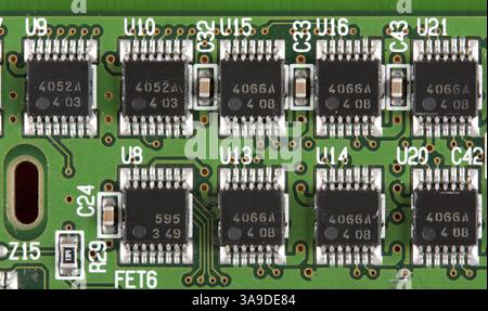 Chips on a green printed electronic board Stock Photo