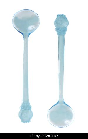Two blue transparent plastic spoons on white background Stock Photo