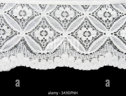 White lace with pattern in the manner of flower on black background Stock Photo