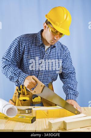 Men cutting plank Stock Photo