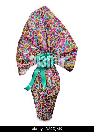Easter chocolate egg wrapped in paper with multicolored designs with green satin bow isolated on white Stock Photo
