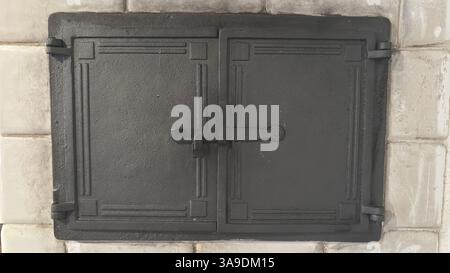 Cast iron doors. Interior fittings. Oven door. Vintage style. Stock Photo