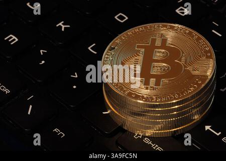 Close up of Bitcoin on computer keyboard Stock Photo