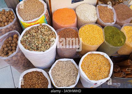 Close-up view of bags of various spices, nuts and dried fruits at the bazaar in Manama, Bahrain Stock Photo