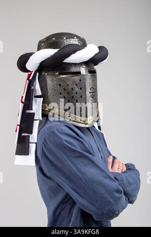 Medieval Knight Helmet with White and Black Drapery Stock Photo