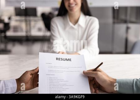 Positive female job applicant woman talking to two recruit managers Stock Photo
