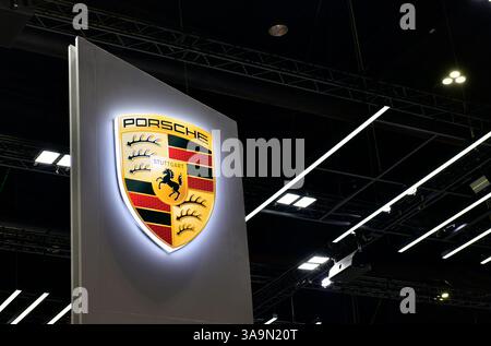 Thailand-March 26,2025: New Porsche sign logo German automobile manufacturer specializing in high-performance sports cars at the 46 Bangkok Internatio Stock Photo