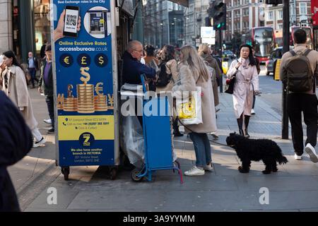 An Evening Standard weekly publication distribution stand for free pick-up across London, outside Liverpool Street Station, City of London, England. Stock Photo