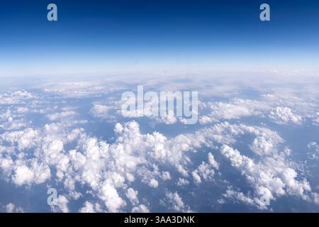 Background of white clouds against a blue sky. Stock Photo