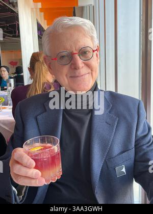 Happy pensioner enjoying a special occasion at the Ark restaurant, Robert located in Columbus Circle, 2025, New York City, USA Stock Photo