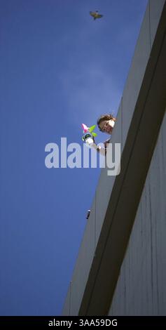 Charity Lehman (cq), 9, from Cowan Fundamental School in Sacramento, CA. prepares to drop an egg holder she made of a large paper cup and snow cone cup from the top of the University of California, Davis' Physics & Geology Building on Friday, February 23, 2001. Area kids from Sacramento, Davis and Woodland came to the campus with hand made egg holders that were dropped from five stories high, the egg-drop contest was all about building a contraption to keep your egg from breaking from the fall. (Sacramento Bee/Jose M. Osorio)  Sacramento Bee/ZUMA Press Stock Photo