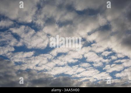 Formation of white and grey clouds with patches of blue sky above Blarney County Cork Ireland Stock Photo