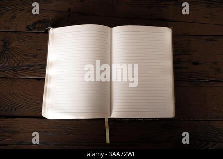 Opened Blank Book on the Wooden Planks Background closeup Stock Photo