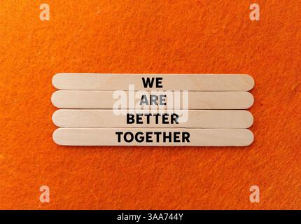 We are better together message written on ripped orange torn paper ...