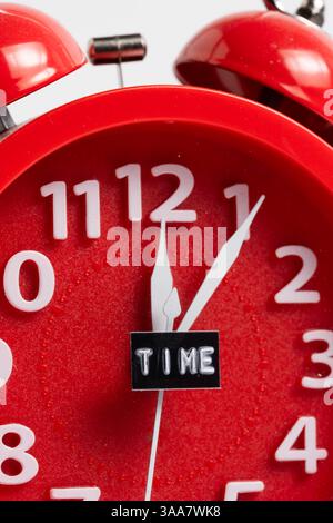 Red alarm clock on white background. Time concept. Closeup Stock Photo