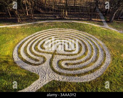 Aerial view of a circular park with a winding path in a residential ...