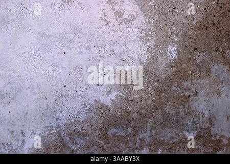 Weathered and textured concrete wall, perfect for backgrounds, textures, industrial design projects, architecture, construction, and rustic visuals. C Stock Photo