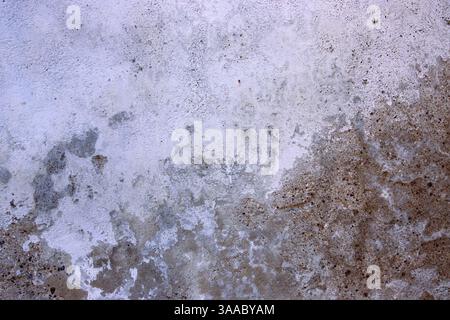 Weathered and textured concrete wall, perfect for backgrounds, textures, industrial design projects, architecture, construction, and rustic visuals. C Stock Photo