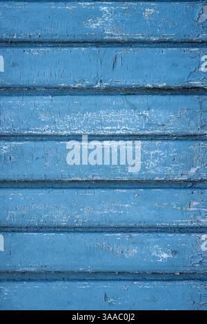 Rustic blue turquoise teal wooden boards with cracked and peeling chipped paint. Perfect for grunge textures, aged material themes for creative backgr Stock Photo