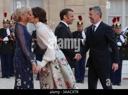 Paris, France. 31st Mar, 2025. French President Emmanuel Macron and his wife, Brigitte (L), greet King Frederik X (R) and Queen Mary of Denmark at the Elysee Palace in Paris, France, on Monday, March 31, 2025. The Danish royals are in the French capital on a three-day state visit. Photo by Maya Vidon-White/UPI Credit: UPI/Alamy Live News Stock Photo