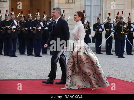 Paris, France. 31st Mar, 2025. King Frederik X and Queen Mary of Denmark walk past republican guards upon arrival at the Elysee Palace in Paris, France, on Monday, March 31, 2025. The Danish royals are in the French capital on a three-day state visit. Photo by Maya Vidon-White/UPI Credit: UPI/Alamy Live News Stock Photo