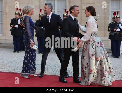 Paris, France. 31st Mar, 2025. French President Emmanuel Macron and his wife, Brigitte (L), greet King Frederik X and Queen Mary of Denmark (R) at the Elysee Palace in Paris, France, on Monday, March 31, 2025. The Danish royals are in the French capital on a three-day state visit. Photo by Maya Vidon-White/UPI Credit: UPI/Alamy Live News Stock Photo