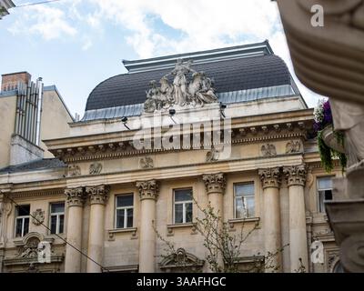 Building exterior of the Embassy of the Hellenic Republic Greece in Vienna. Sculpture at the roof above the entrance. Architectural feature. Stock Photo