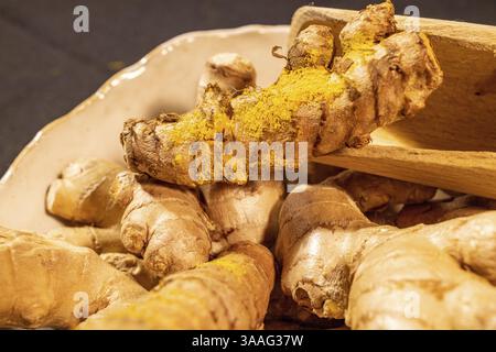 Ginger and Turmeric Roots on a dark background Stock Photo