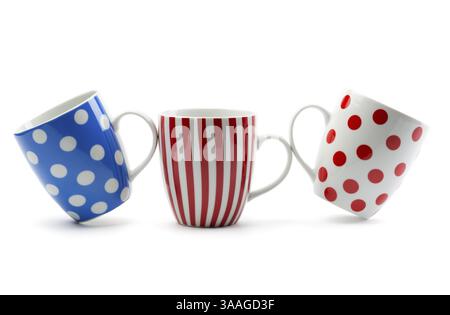 Three porcelain cup with stripes and dots. Isolate on white Stock Photo
