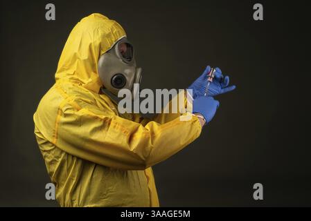 Man in protective suit with gas mask during a disaster drill Stock Photo