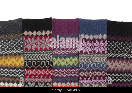 Warm woolen Stockings knitted with national winter pattern on a white background Stock Photo